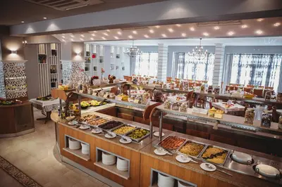 a buffet line with many different types of food at Hotel Wela - Premium All Inclusive in Sunny Beach