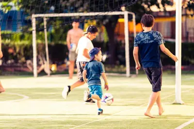 a group of children playing soccer on a field at Hotel Wela - Premium All Inclusive in Sunny Beach