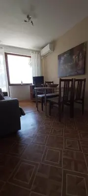a living room with chairs and a painting on the wall at Tanja in Sveti Vlas