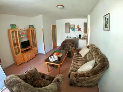 a living room with two couches and a table at Apartment in St. Vlas with terrace in Sveti Vlas
