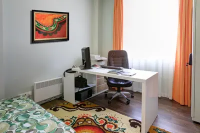 an office with a desk with a computer and a chair at City Boutique Inn in Varna City