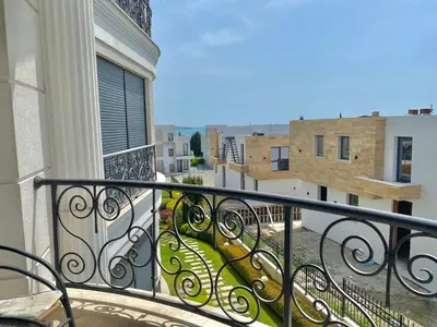 a balcony with a view of a city at Apartments in Complex Sunny Island Deluxe in Chernomorets