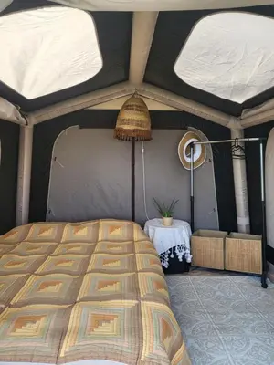 a bedroom with a bed in a tent at Ecoclub in Varna City