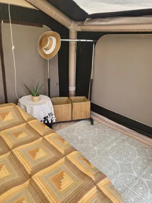 a room with a bed and a table in a trailer at Ecoclub in Varna City