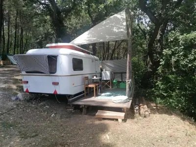 a white trailer with a table and a tent at Ecoclub in Varna City