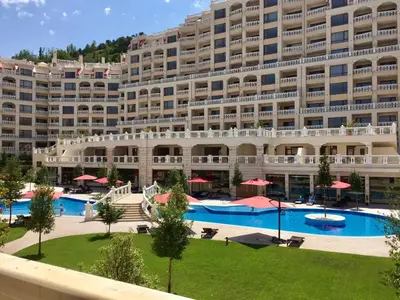 a large apartment building with a large swimming pool at PSB Apartments in South Bay Varna in Varna City