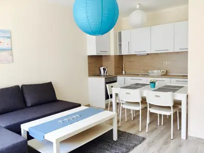 a living room with a couch and a table at PSB Apartments in South Bay Varna in Varna City