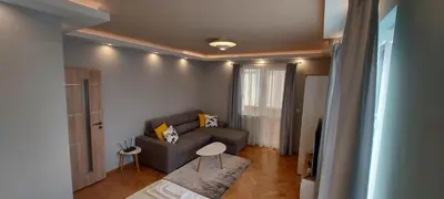 a living room with a couch and a table at Black Sea View - Luxory apartment by the sea in Burgas City