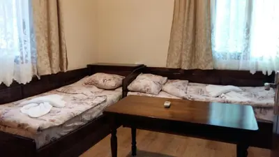 a room with two beds and a coffee table at к-г Луна к-с Лонгоза комплекс Лонгоза in Byala