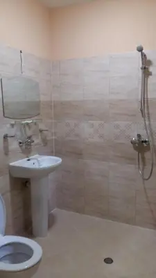 a bathroom with a shower and a toilet and a sink at к-г Луна к-с Лонгоза комплекс Лонгоза in Byala