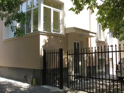 a black fence in front of a house at De Luxe Studio Burgas, City Center in Burgas City