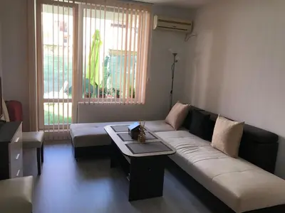 a living room with a couch and a table at Apartamenti Eli in Pomorie