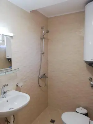 a bathroom with a sink and a shower at Guest House Dimovi in Sozopol