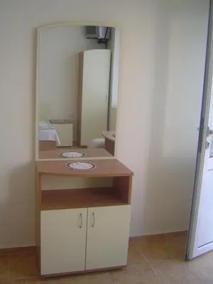a bathroom with a sink and a mirror at Guest House Dimovi in Sozopol