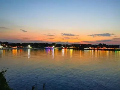 a view of a large body of water at sunset at Guest House Dimovi in Sozopol