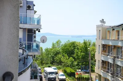 a view of a street between two buildings at Ivanovi Apartments in Burgas City