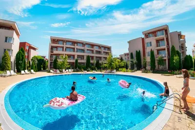 a group of people playing in a swimming pool at Nessebar Fort Club Apartments in Sunny Beach