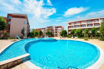 a large swimming pool in front of some buildings at Nessebar Fort Club Apartments in Sunny Beach