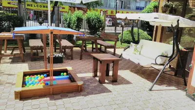 a table and an umbrella and a pool of balls at Golden Dreams Apartment in Sunny Beach