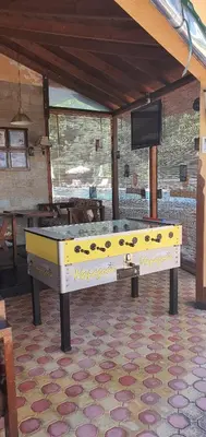 a large yellow ping pong table in a room at Golden Dreams Apartment in Sunny Beach