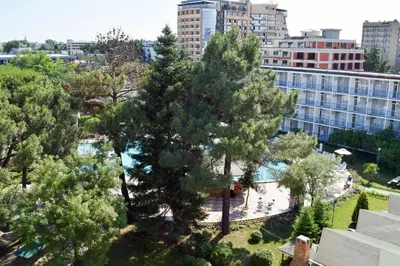 an overhead view of a park with trees and a building at Balaton Hotel in Sunny Beach