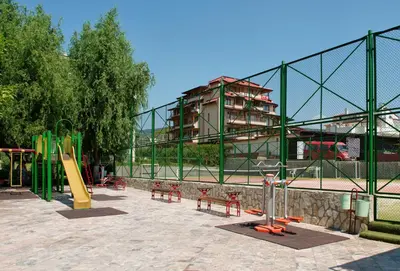 a park with a playground with a slide at Green Fort Private Apartments in Sunny Beach