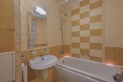 a bathroom with a sink and a toilet and a bath tub at Royal Sun Apartments in Sunny Beach