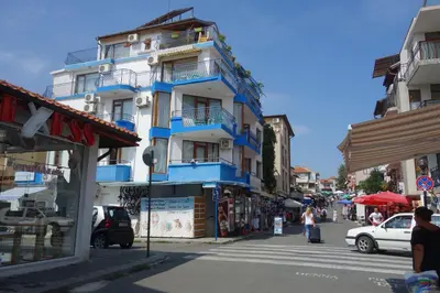 a blue and white building on the side of a street at Aquamarine in Sozopol