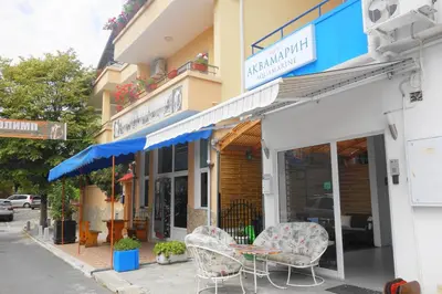 a table and chairs sitting outside of a building at Aquamarine in Sozopol