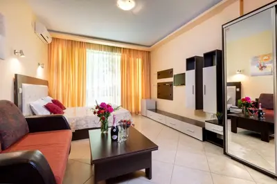 a large living room with a couch and a bed at Hotel St Valentine all inclusive in Sunny Beach