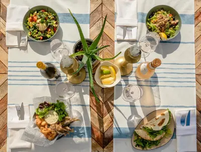 a table with three plates of food on it at Relax Sozopol in Sozopol