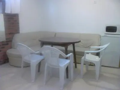 a living room with a table and chairs and a couch at GoodRest Nesebar in Nesebar