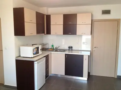 a small kitchen with a sink and a microwave at GoodRest Nesebar in Nesebar