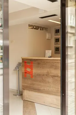 a view of the reception desk of a hyper light store at Hugo Hotel in Varna City