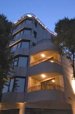 a tall building with balconies on the side of it at Hotel Divesta - self check in in Varna City