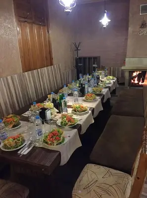 a row of tables with plates of food on them at Sea Horse in Burgas City