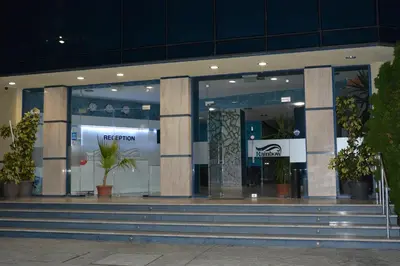 a store front with stairs in front of a building at Rainbow 1 Holiday Complex in Sunny Beach