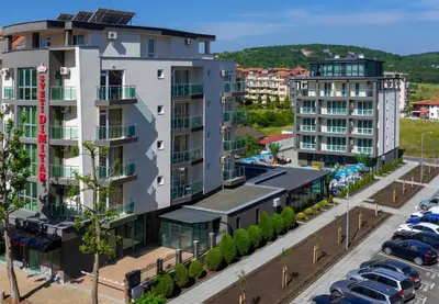 an aerial view of a parking lot with buildings at Sveti Dimitar Hotel in Primorsko