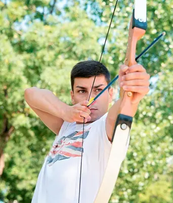 a man holding onto a bow and arrow at Sol Nessebar Bay All Inclusive in Nesebar