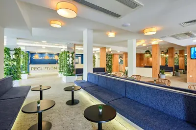 a lobby of a hotel with couches and tables at Casablanca Hotel - All Inclusive in Obzor
