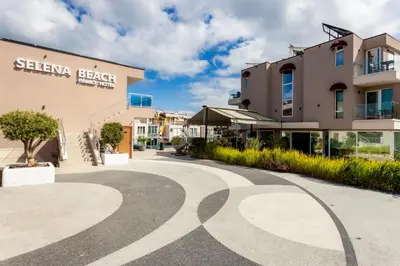 a walkway in front of a building at Selena Beach Family Hotel - All Inclusive Light in Sozopol