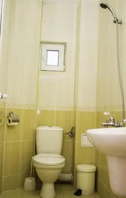 a bathroom with a toilet and a sink at ,,Дироси'' in Sveti Vlas