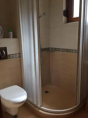 a bathroom with a shower and a toilet at Santa Marina Apartment 513 in Sozopol