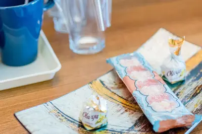 a wooden table with two bags of food on it at Hotel Burgas in Burgas City