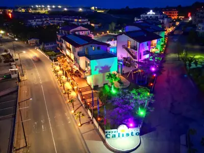 a city lit up at night with street lights at Royal Calisto Hotel in Sozopol