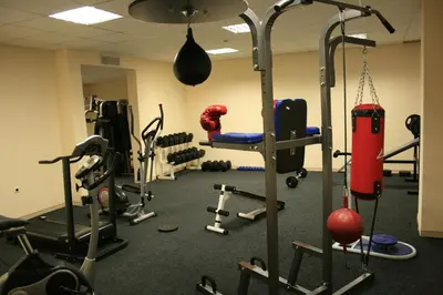 a gym with lots of equipment in a room at Hotel Princess Residence in Kiten