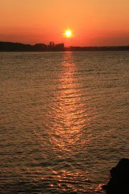 a sunset over a large body of water at Hotel Princess Residence in Kiten