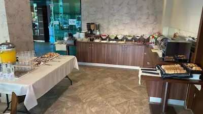 a buffet line with a table with food on it at Hotel L&B- Free parking in Sunny Beach