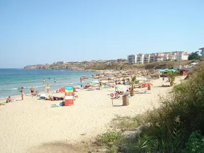 a group of people on a beach with the ocean at Family Hotel Muses in Sozopol