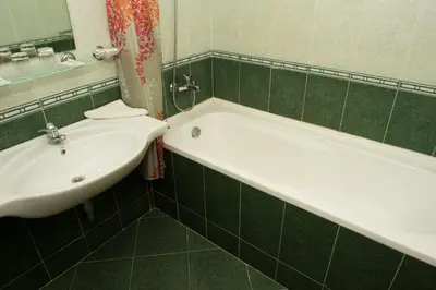 a bathroom with a white tub and a sink at Ivana Palace Hotel - Free Parking in Sunny Beach